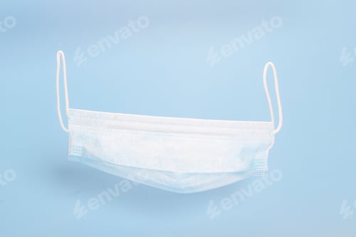 Preview: Disposable Face Mask on Light Blue Background