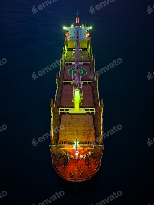Preview: Aerial view cargo bulk carrier ship on the sea at night