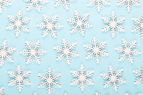 Preview: Christmas background. White snow decorations on a pink background.