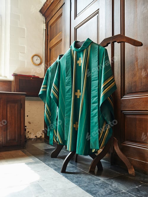 Preview: Green religious robes hanging in church interior