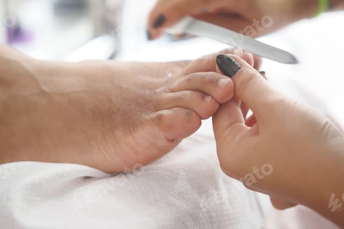 Preview: Pedicure session at a salon focusing on foot care and grooming