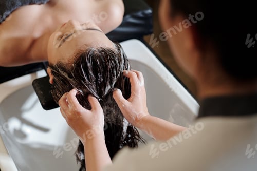 Preview: Woman Having Her Hair Shampooed at Salon