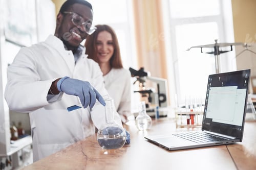 Preview: Laboratory laboratories conduct experiments in a chemical laboratory in transparent flasks. Output