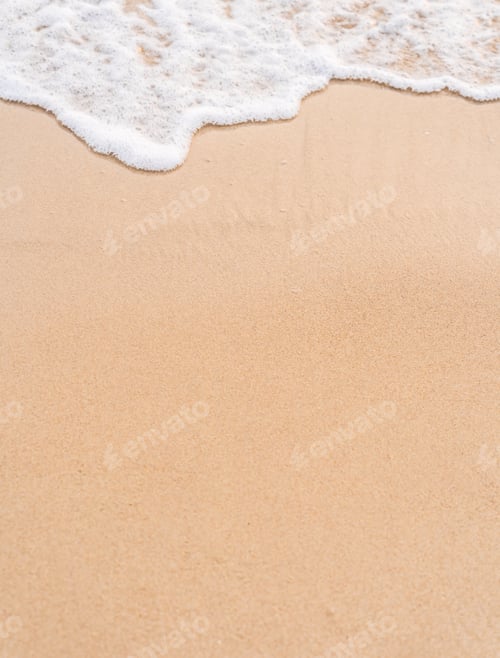 Preview: Sand beach and white wave vertical in summer season well free space for text presentation