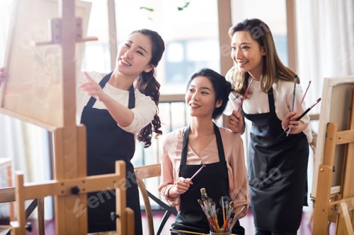 Preview: Young women painting in studio