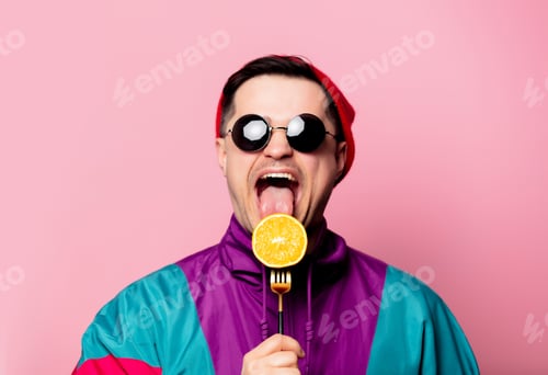 Preview: Style guy in glasses with orange on a fork