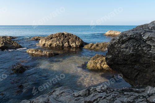 Preview: Rocks on the sea in the early morning.