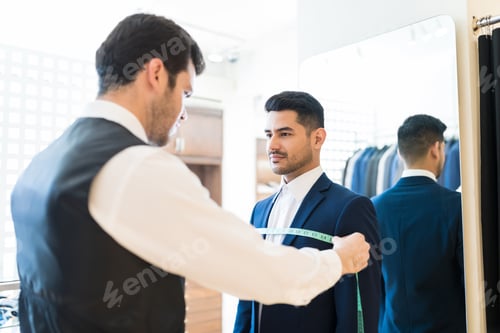 Preview: Man Visiting Young Tailor At Suit Rental Shop
