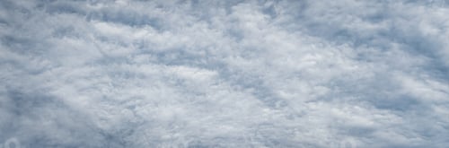Preview: Fleecy clouds texture, cloudy sky background, wide banner size gray cloudscape