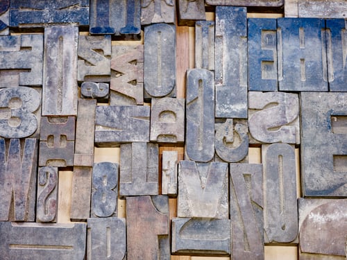 Preview: Close up of tray of blue letterpress in printing workshop