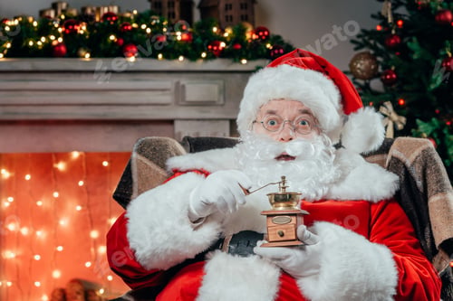 Preview: santa claus in traditional red costume holding coffee grinder
