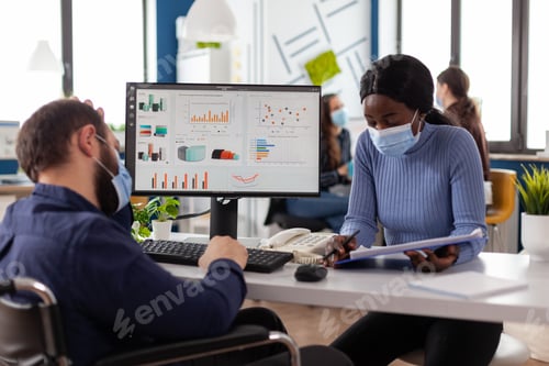 Preview: Multi-ethnic business team with medical face mask against coronavirus