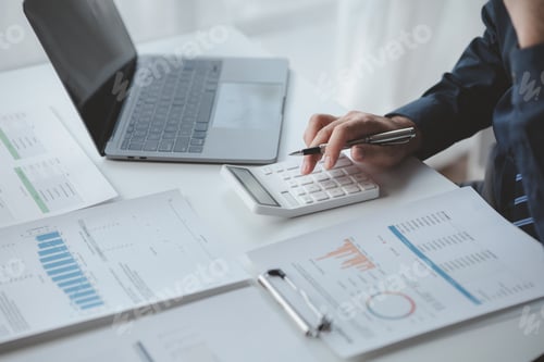 Preview: Businessman in a private office at his company and is reviewing company financial documents, senior