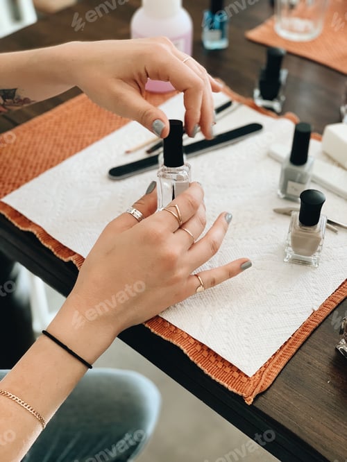 Preview: Woman Doing Nails at Home on Table