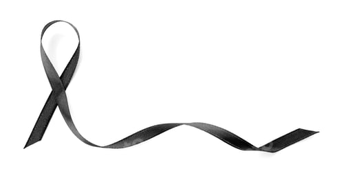 Preview: Black ribbon on white background, top view. Funeral symbol