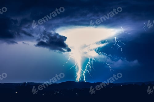 Preview: Night landscape on a background of thunderstorms. Rural silhouette and clouds with lightning flashes