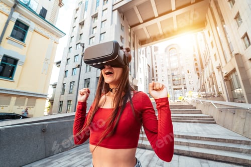 Preview: Woman in a virtual reality helmet walks down the street