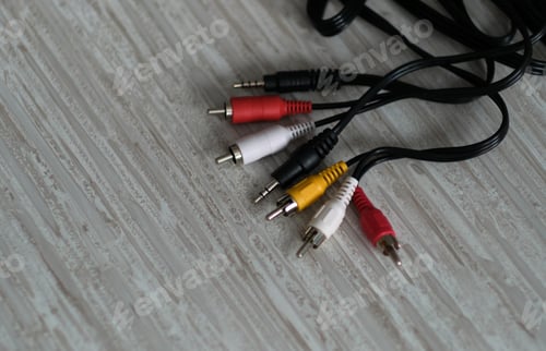 Preview: RCA cables, with their distinctive colors, sit ready to transmit audio and video signals, a nod to