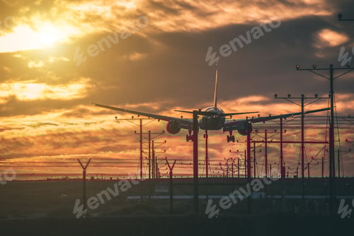 Preview: Airplane Landing at Dusk with Towering Clouds