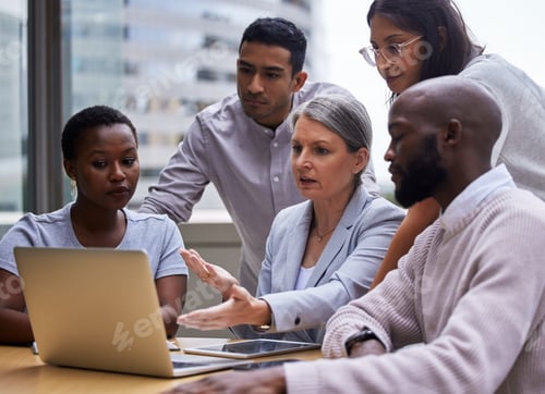 Preview: Shot of a group of professional coworkers using a laptop together at work