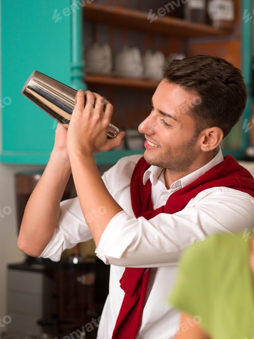 Preview: hadsome bartender preparing a drink