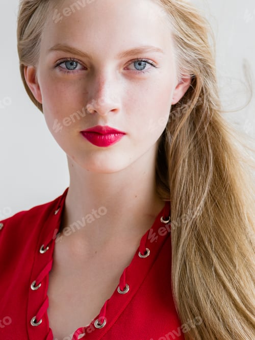 Preview: Nice woman in red dress blonde short hair. Fashion female portrait cute nice girl. Studio shot.