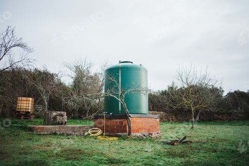 Preview: Green water tank in the countryside