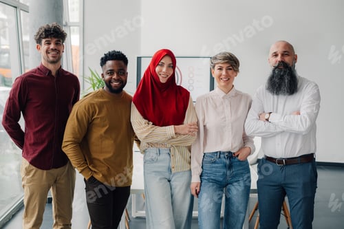 Preview: Diverse business team smiling together in modern office