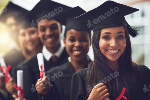 Preview: Shot of a group of fellow students standing in a row on graduation day