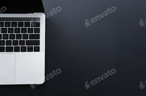 Preview: top view of modern laptop on black with copy space