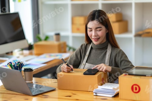 Preview: Asian Small business entrepreneur SME working with box at home, SME e-commerce digital technology co