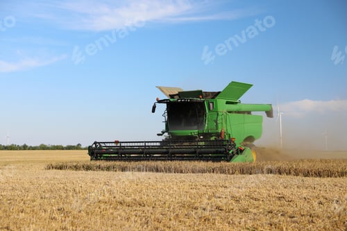 Preview: Modern combine harvester working in agricultural field