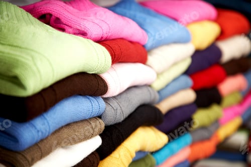 Preview: Colourful Clothes Stacked In A Retail Store - Woolen Jumpers