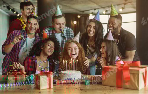 Preview: Friends presenting birthday cake to girl
