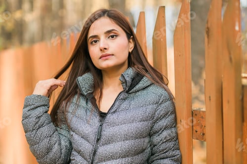 Preview: Close up portrait of pretty indian young woman enjoying warm autumn sunny day vacation outdoor copy