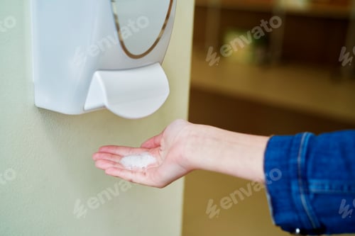 Preview: Close up of using a hand sanitizer during a pandemic