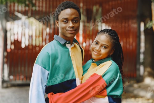 Preview: Ethnic couple walking in city street