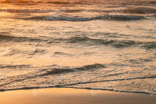 Preview: Sea ocean water surface with small waves at sunset. Evening sunlight sunshine above sea. Ocean water