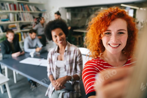 Preview: Diverse employees gathered in the office having fun during brainstorming while discussing new ideas
