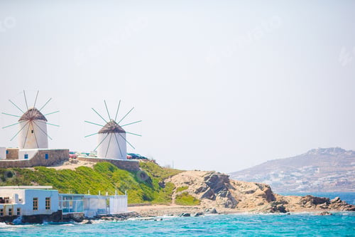 Preview: Famous view of traditional greek windmills on Mykonos island at sunrise, Cyclades, Greece
