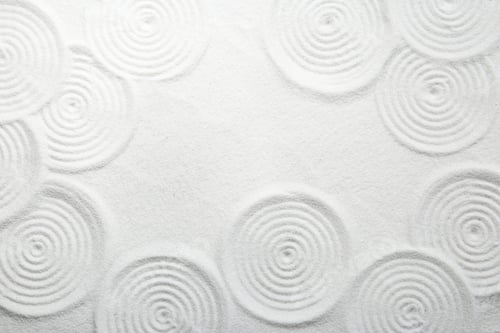 Preview: Zen rock garden. Circle patterns on white sand, top view