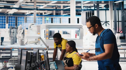 Preview: Inspector in solar panel factory review manufacturing equipment