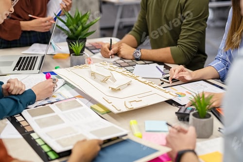 Preview: Architects working on building scale model