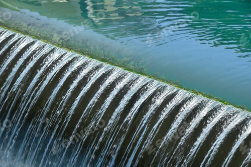 Preview: Blue river water falling from rift with foam