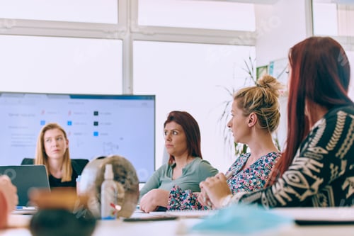 Preview: Diverse Business Team Discussing Projects in a Modern Glass Office.