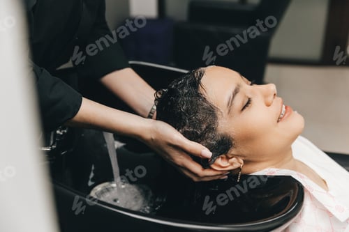 Preview: Woman Relaxing and Getting Hair Washed in Salon