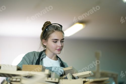 Preview: Cropped shot of a young female carpenter, Small business of a young woman.
