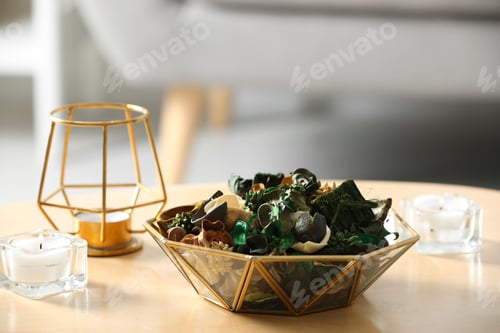 Preview: Aromatic potpourri of dried flowers in bowl on wooden table indoors