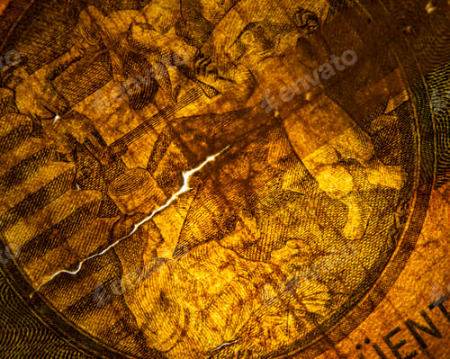 Preview: Closeup macro shot of a paper currency bill, with various elements of the design