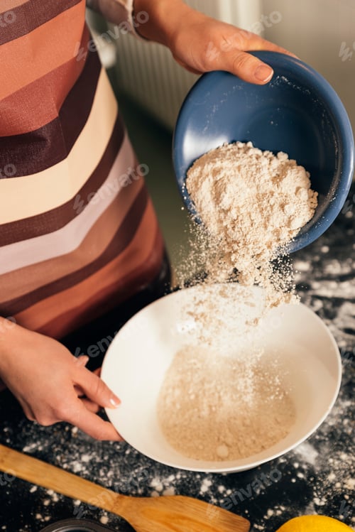 Preview: Beautiful woman Preparing Cookies And Muffins.